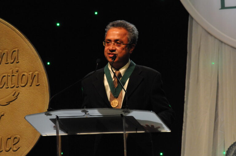 OU Civil Engineering Professor K.K. "Muralee" Muraleetharan accepts the Medal for Excellence Award in Research University Teaching.